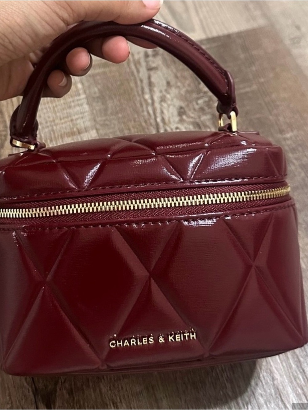 Charles & Keith Deep Burgundy Quilted Glossy Top-Handle Cosmetic Case